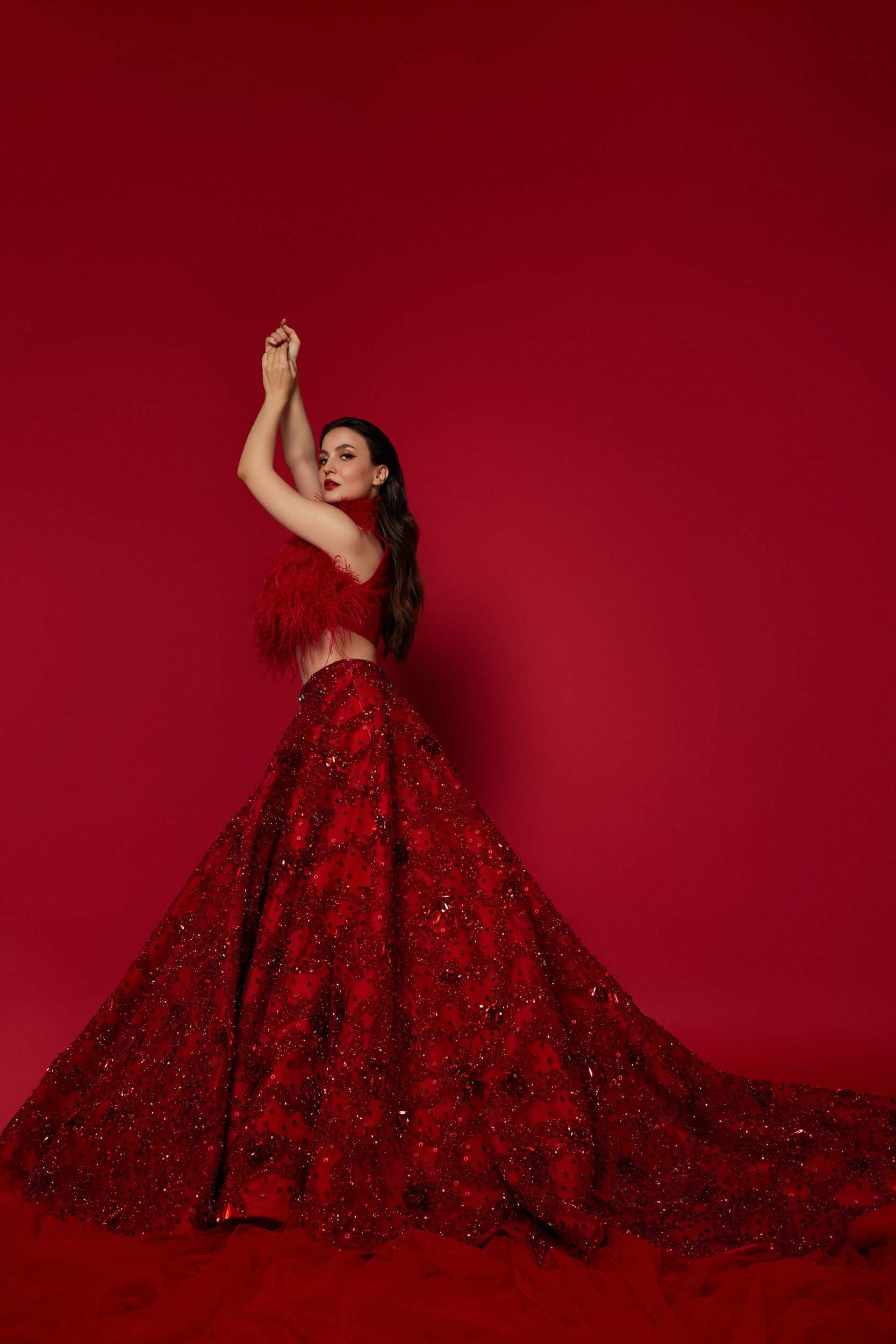 Mermaid Cut Red Lehnga with Corset and Feather Jacket