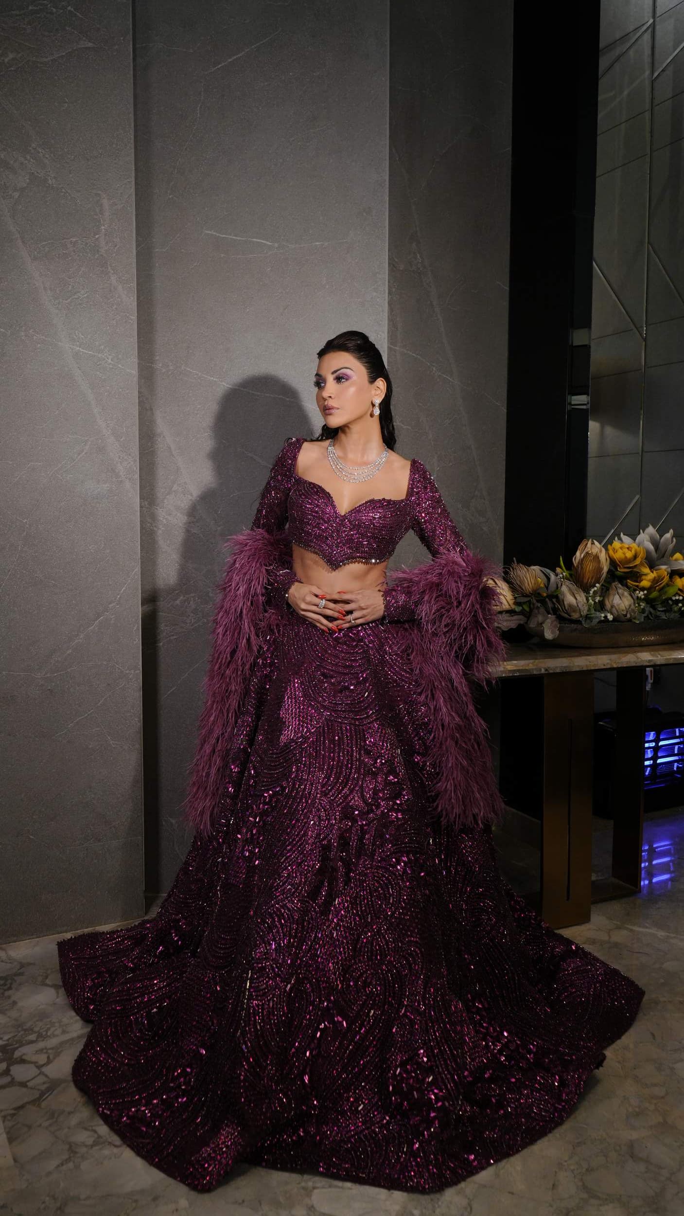 Glistening Grape Flared Lehnga with Deep Neck Choli and Shoulder Cape